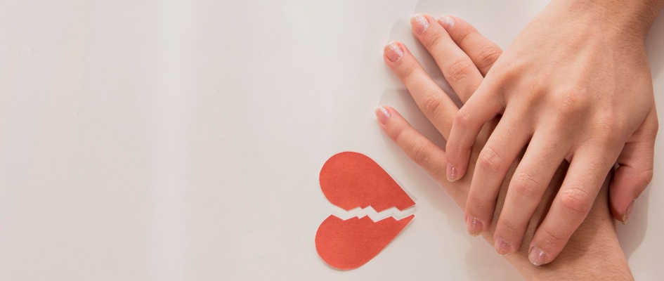 top-view-hands-with-broken-heart
